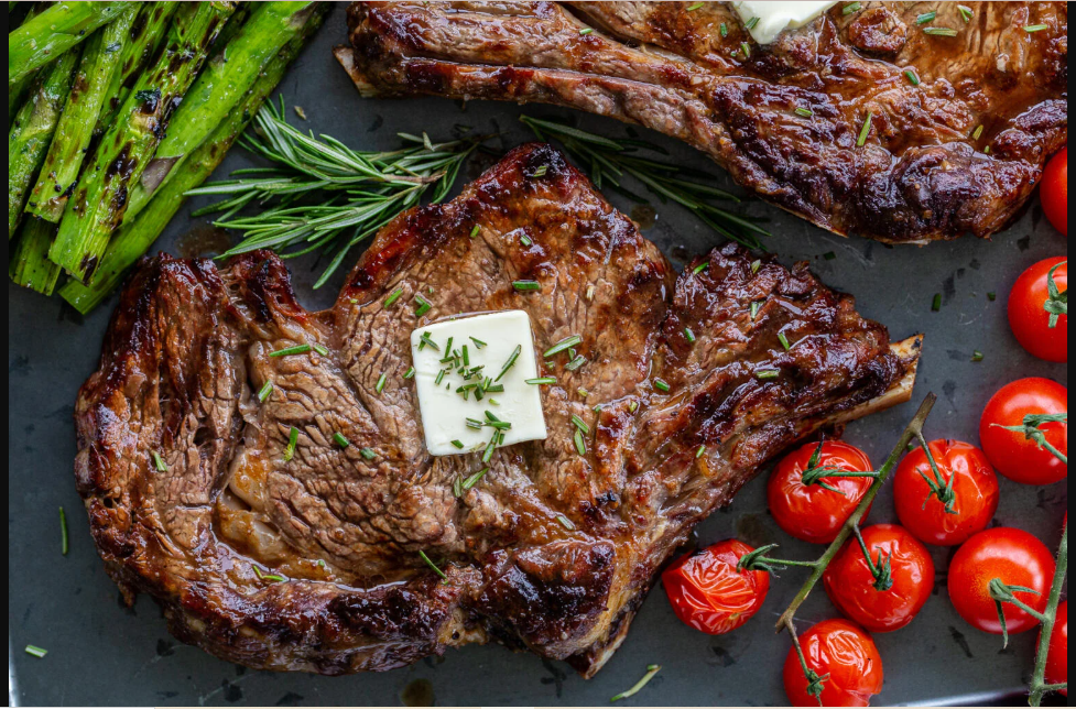 Juicy steak and asparagus on a plate – a delicious local meal.